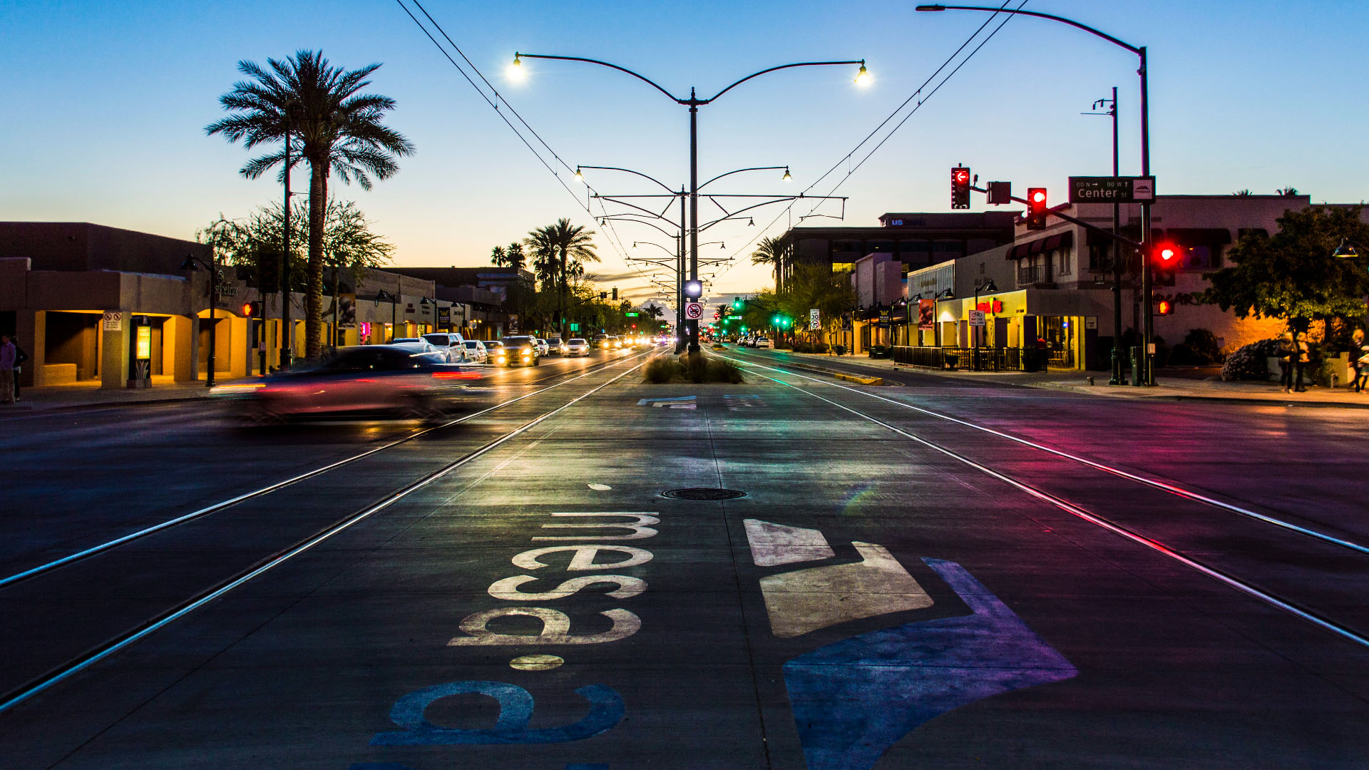 Downtown Mesa, Arizona at dusk, showing city lights and local streets representing trusted massage therapists and wellness professionals across Maricopa County.