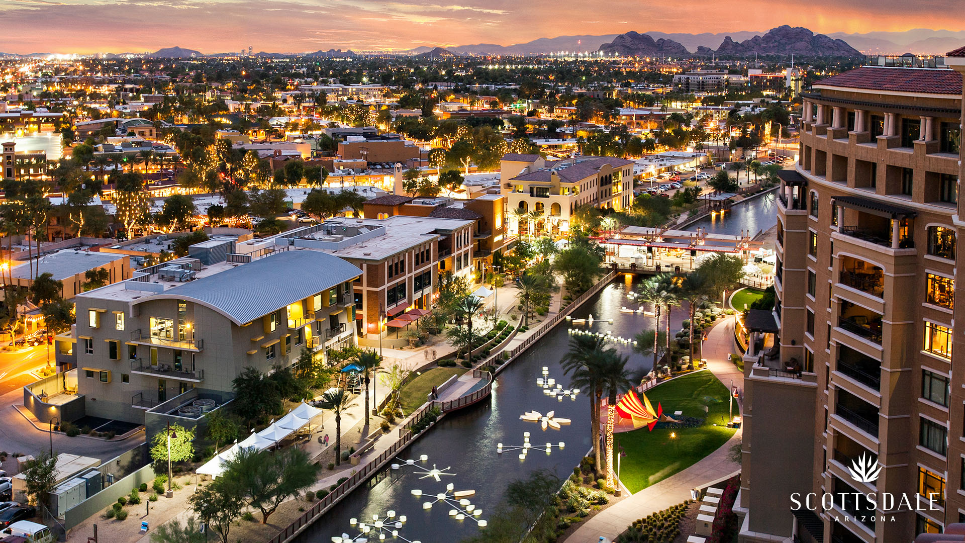 Downtown Scottsdale Arizona waterfront at sunset showing city lights and canal walk