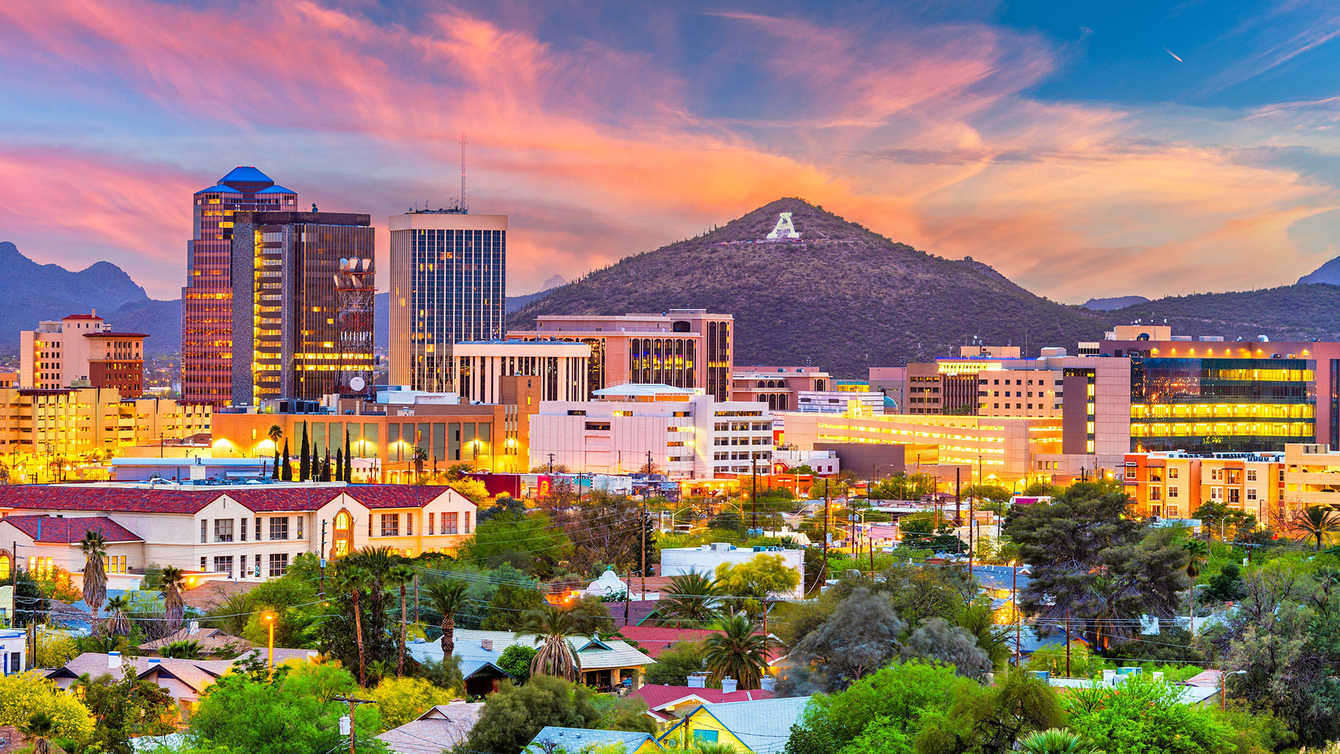 Downtown Tucson skyline at sunset, representing licensed massage therapists and wellness professionals across Pima County, Arizona.
