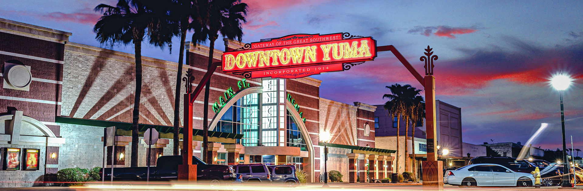 Gateway of the Great Southwest Neon Sign Neon Downtown Yuma sign at dusk near Historic Main Street, a central hub for finding local massage therapists in Yuma, Arizona.