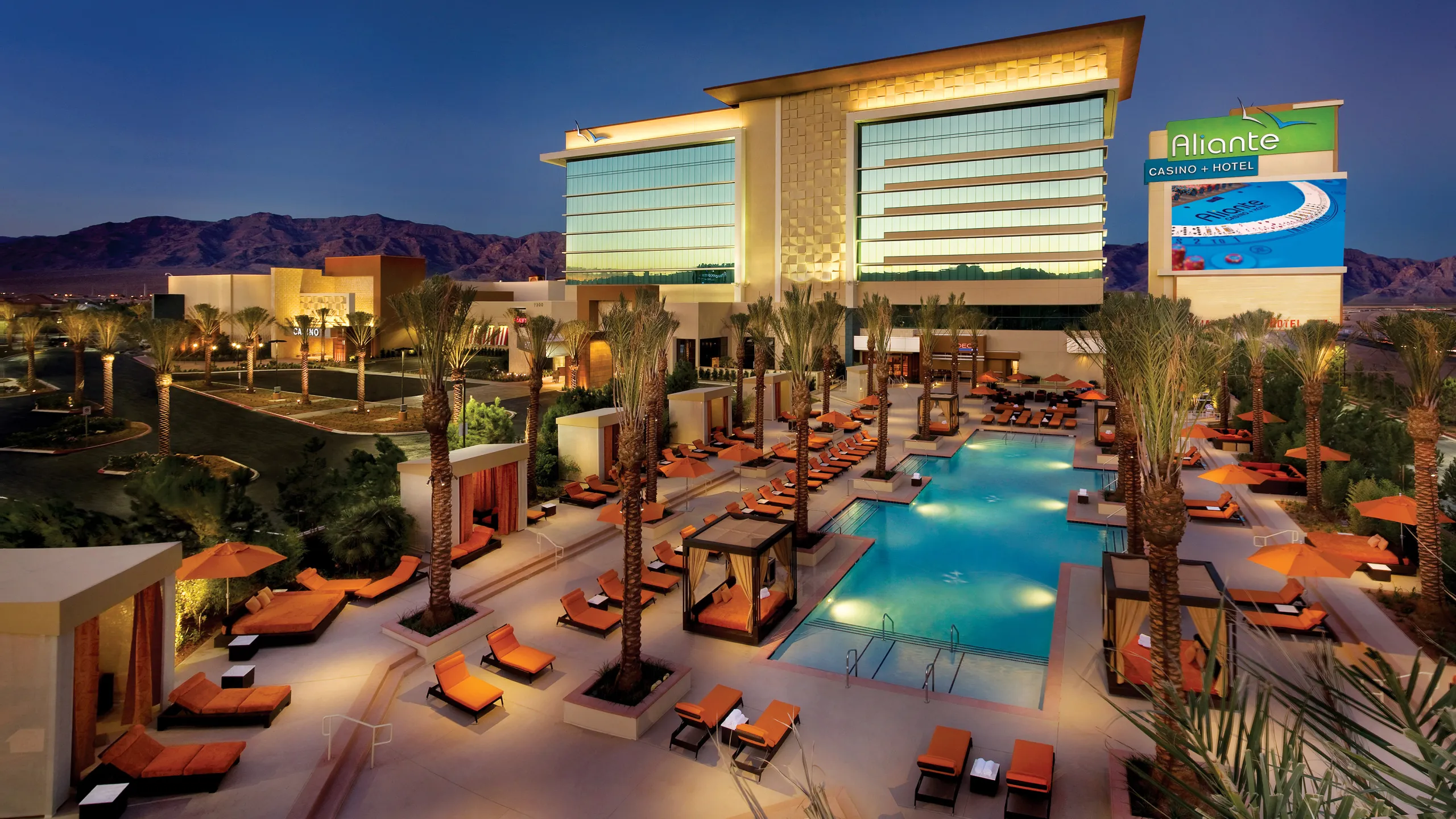 Evening view of a resort spa and pool in North Las Vegas, Nevada, illustrating the relaxing environment served by local licensed massage therapists.
