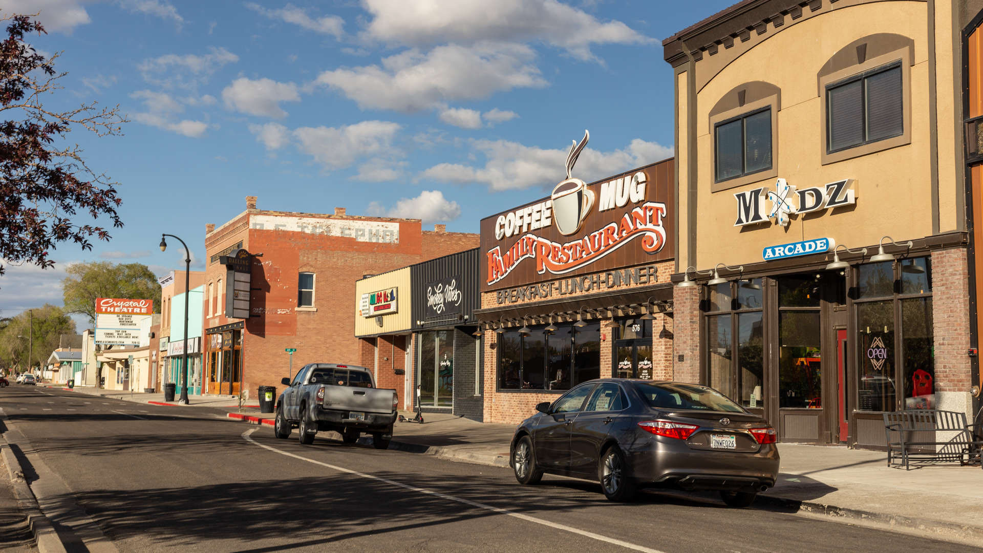 Downtown Elko Nevada street with local shops and restaurants, representing the community served by local massage therapists and wellness services.