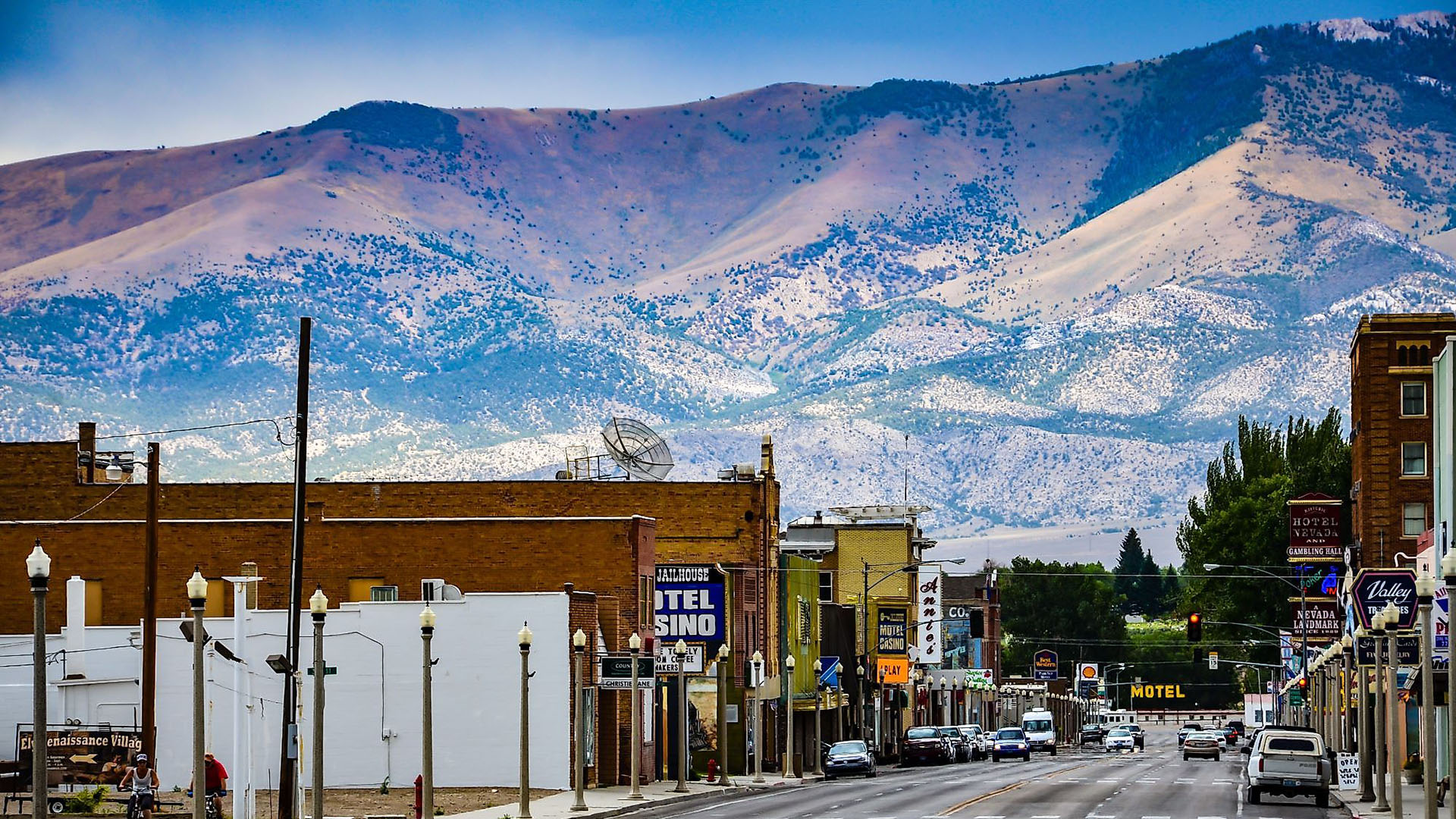 Downtown Ely Nevada street with historic buildings and mountain backdrop, representing local massage therapists and wellness services