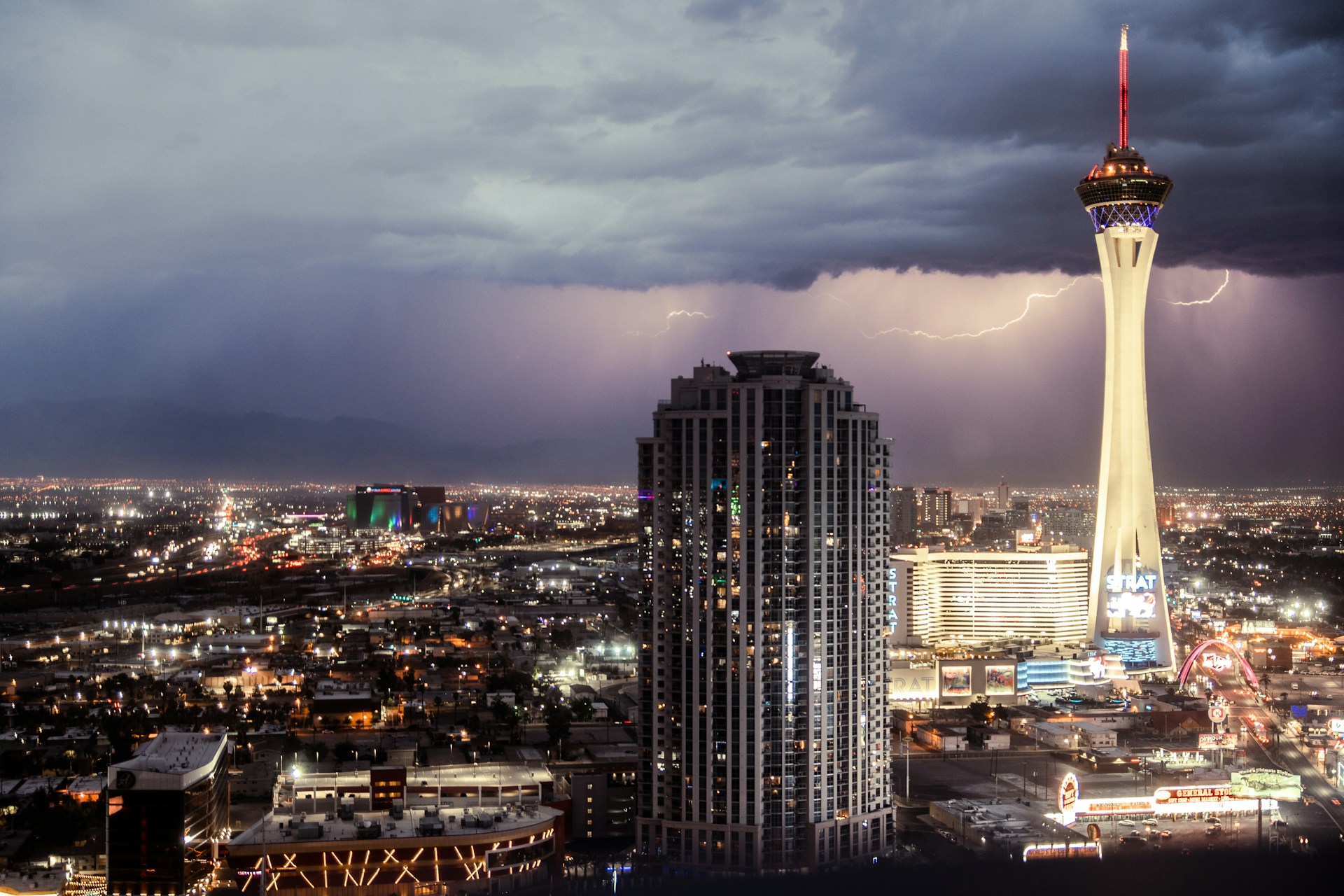 The STRAT and surrounding Las Vegas cityscape during a lightning storm